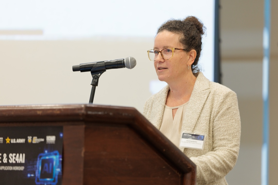 GW Professor presenting at a podium 