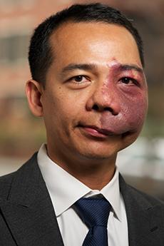 Professor Santos in a black suit