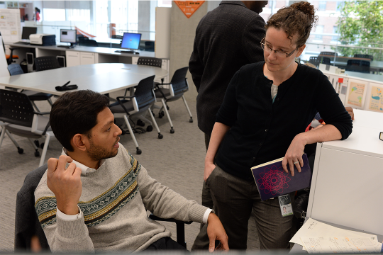 student and professor in discussion